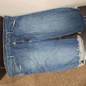 Distressed rip polo shorts